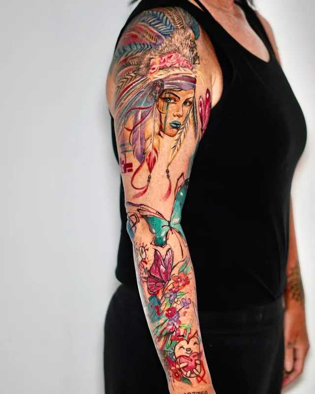 Full colour abstract arm sleeve with a woman's portrait, butterflies and flowers