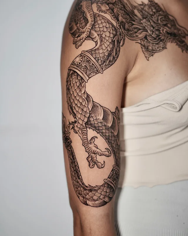 Japanese dragon sleeve in black and grey, side view of the arm