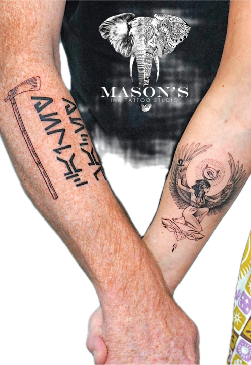 Black and Grey Angel Wings Tattoo with Script and Axe Design