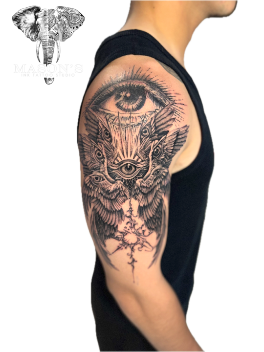 Realism Black and Grey Tattoo Style Wings and Eye